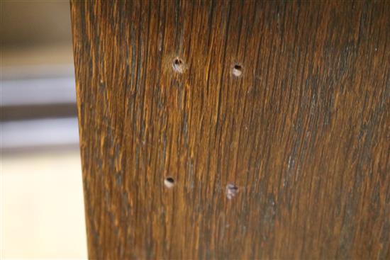 An early 20th century Arts & Crafts oak two door cupboard W.101cm